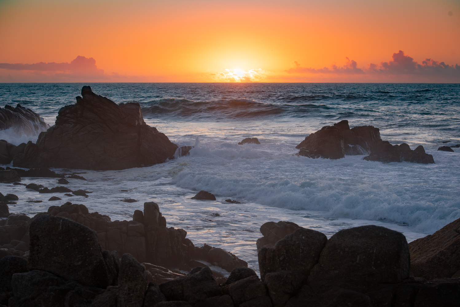 Sunset over the rugged Monterey California coast.